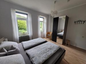 Postel nebo postele na pokoji v ubytování Ferienhaus im Moseltal