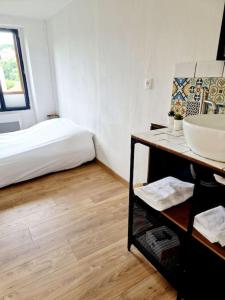 Postel nebo postele na pokoji v ubytování Maisonnette du Foirail