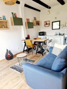 Posezení v ubytování Maisonnette du Foirail