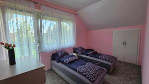 Postel nebo postele na pokoji v ubytování Mária 93