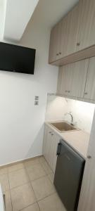 a small kitchen with a sink and a counter at Christinas 3 in Nerántza
