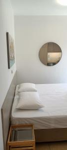 a bedroom with a bed with a glass table at Christinas 3 in Nerántza