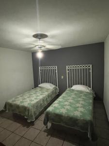 Katil atau katil-katil dalam bilik di HOTEL JERUSALEM