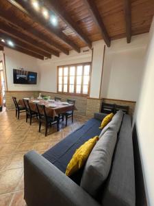 a living room with a couch and a table at UIM Planta baja Canovas del Castillo, PLAYA WIFI in Puerto de Sagunto
