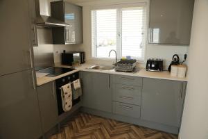 a kitchen with a sink and a counter top at 406 Sea View Road in Bridlington