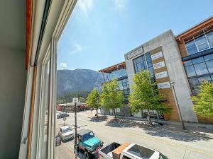 a view from a window of a parking lot at Crash Hotel Squamish in Squamish