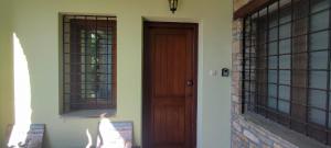 een deur en een raam op een huis bij Forest, sea, stone, junior suite in Tsagarada