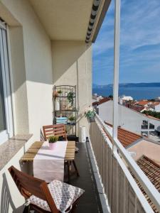 a balcony with a table and chairs and a view at Top view in Crikvenica