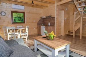 a living room with a couch and a table at Bungalow Jajce 1 in Jezero +49 photos