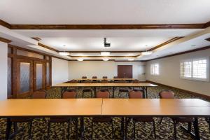 a large room with tables and chairs in it at Best Western Plus Landmark Hotel in Ballard