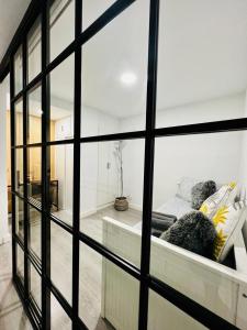 a view of a bedroom through a window at BEST FLAT NEAR REAL MADRID STADIUM in Madrid