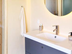 a bathroom with a sink and a mirror at 8 person holiday home in Frøstrup-By Traum in Lild Strand +20 photos