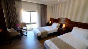 Ένα ή περισσότερα κρεβάτια σε δωμάτιο στο Christmas Hotel - Jerusalem