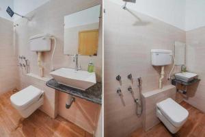 a bathroom with a sink and a toilet and a mirror at OYO Hotel Rudraksh Residency in Bhilai