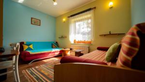 a living room with a couch and a window at Apartment David in Tršće