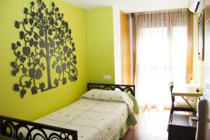 Postel nebo postele na pokoji v ubytování Rincón de Gala