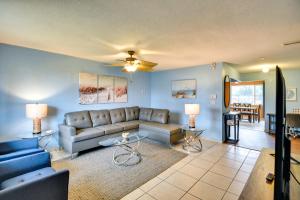 a living room with a couch and a table at Florida Escape with Pool, Near Beaches and Kayaking! in Daytona Beach
