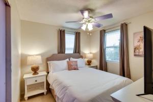 a bedroom with a bed and a ceiling fan at Florida Escape with Pool, Near Beaches and Kayaking! in Daytona Beach +16 photos