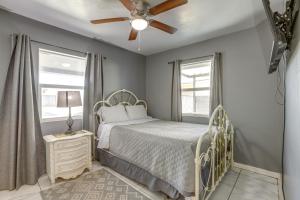 a bedroom with a bed and a ceiling fan at Pet-Friendly Phoenix Vacation Rental Near Downtown in Phoenix