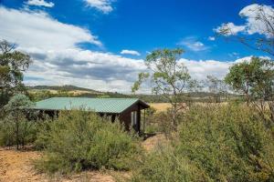 an old building in the middle of a field at Lappi Farm in Berridale