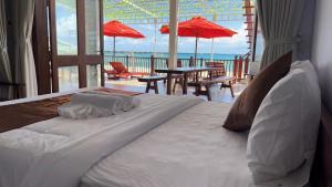 Postel nebo postele na pokoji v ubytování The Poplar Resort Phú Quốc