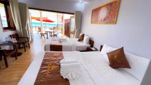 Postel nebo postele na pokoji v ubytování The Poplar Resort Phú Quốc