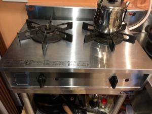a stove top with a tea kettle on top of it at ひろの家 in Fukuchiyama