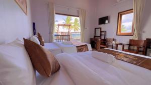 Postel nebo postele na pokoji v ubytování The Poplar Resort Phú Quốc
