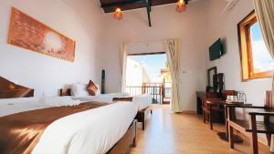 Postel nebo postele na pokoji v ubytování The Poplar Resort Phú Quốc