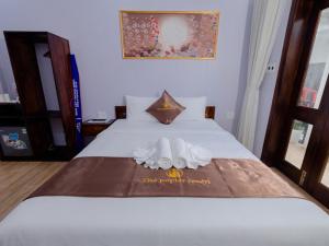 Postel nebo postele na pokoji v ubytování The Poplar Resort Phú Quốc