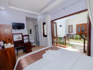 Postel nebo postele na pokoji v ubytování The Poplar Resort Phú Quốc