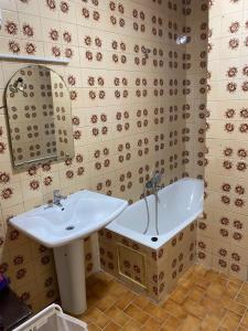 a bathroom with a sink and a bath tub at Appartement boulevard Mohamed 5 in Tangier +10 photos