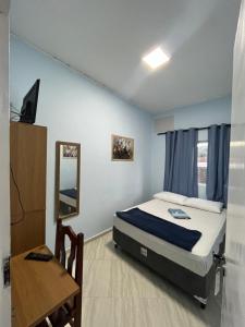 Ένα ή περισσότερα κρεβάτια σε δωμάτιο στο Hotel Cidade Paisagem