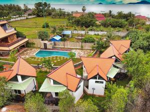 an aerial view of a resort with a swimming pool at LA PETITE MANGROVE Resort in Phumĭ Srângam