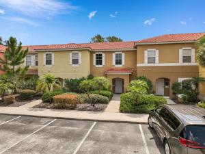 a car parked in a parking lot in front of a building at Wish Upon A Splash - Family Villa - 3BR - Private Pool - Disney 4 miles in Kissimmee