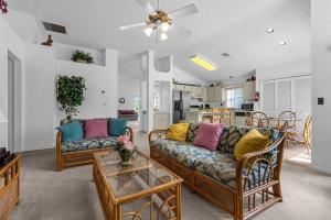 a living room with two couches and a table at 2974 Viscount Villa 3bed+ Pool&Spa in Kissimmee