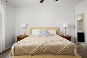 a bedroom with a large bed with two lamps at Scottsdale Escape - Pool, Spa, Firepit, & Pool Table in Phoenix