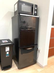 Kuchyň nebo kuchyňský kout v ubytování guesthouse Nakatsu