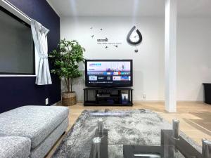 TV a/nebo společenská místnost v ubytování guesthouse Nakatsu