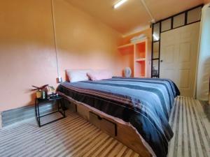Ένα ή περισσότερα κρεβάτια σε δωμάτιο στο Casa contenedor Finca la laguna +15 φωτογραφίες
