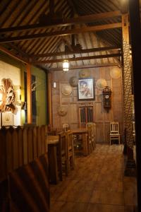 a restaurant with a table and chairs in a room at Tirta Arsanta Hot Springs & Villa in Bogor