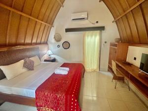Un ou plusieurs lits dans un hébergement de l'établissement Gili Land