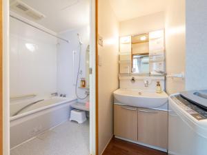 Vannituba majutusasutuses Travel Inn Kofu