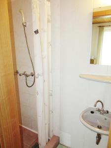 a bathroom with a shower and a sink at Zsuzsa Panzió in Balatonfüred