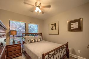 a bedroom with a bed and a ceiling fan at CW B202 Camp Warnecke B202 in New Braunfels