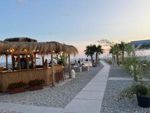 a bar on the beach next to the beach at Villa Lidia in Paola