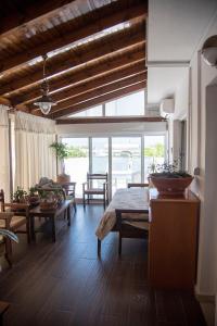 a living room with a bed and a table at STAVROS amazing apartment in the centre of KOS in Kos Town