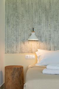 A bed or beds in a room at Junior suite by the beach Stalida