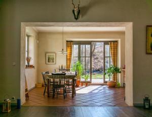 a dining room with a table and chairs at Villa Kingfisher in Åminnefors