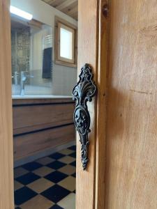 a wooden door with a handle in a bathroom at Casa Vicent in Alcanar +12 photos